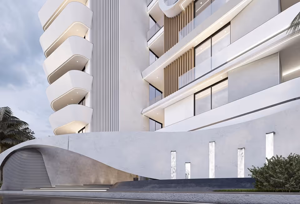 Looking up at Curve's curved balconies against the sky.