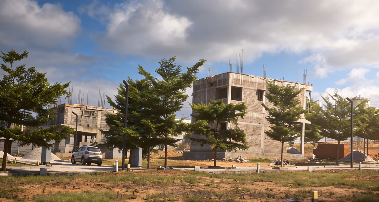 A house under construction on a plot at Fadal, trees along the road behind.
