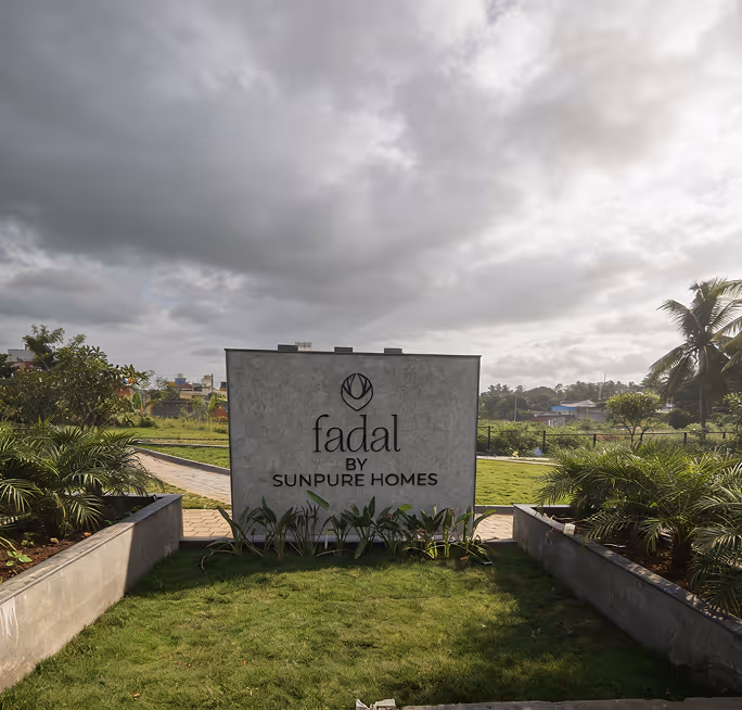 The Fadal entrance marker seen across open ground.