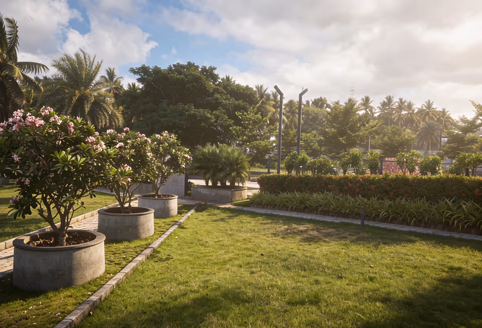 Mown lawn and young trees along a Fadal walkway.