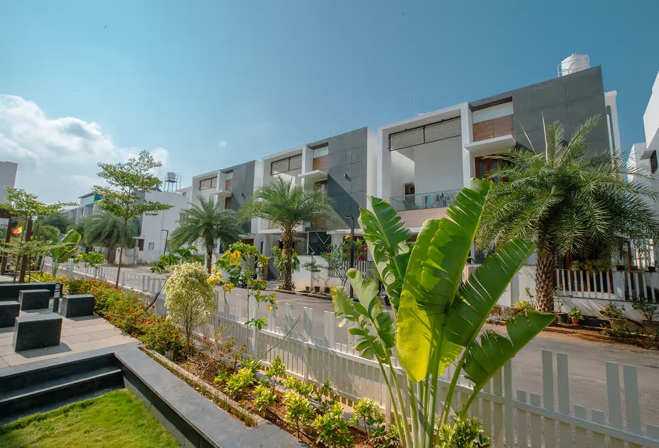 Planting and garden beds in the open space between the Happiness 1 villas.
