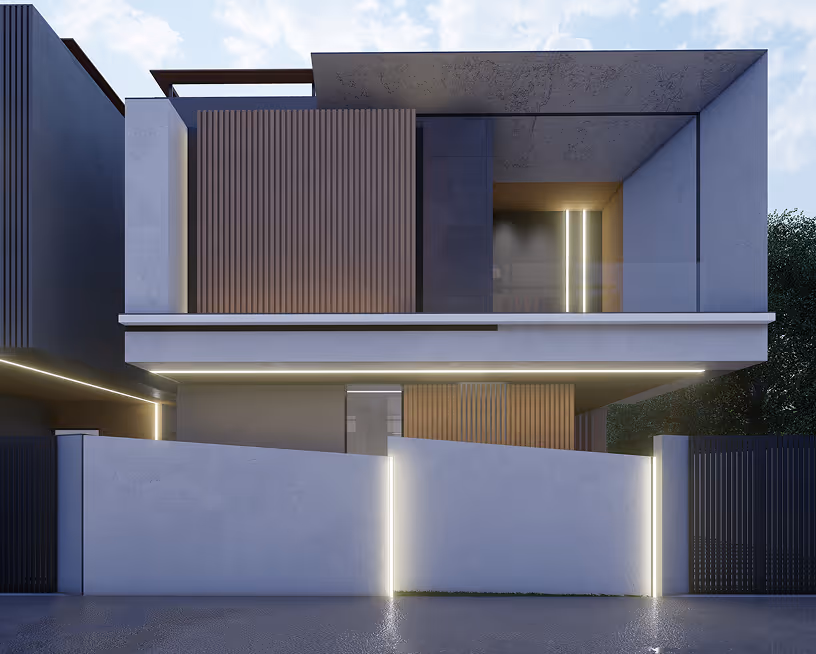 Evening view of a Happiness 2 villa, its ground floor glazing lit.