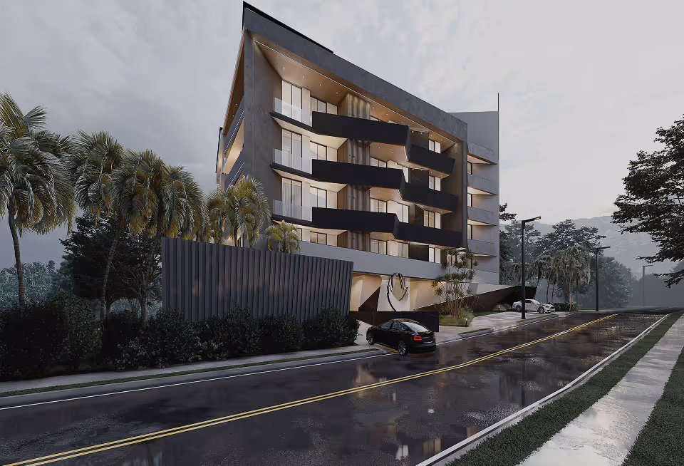 The V4 block along its street frontage, lit at dusk.