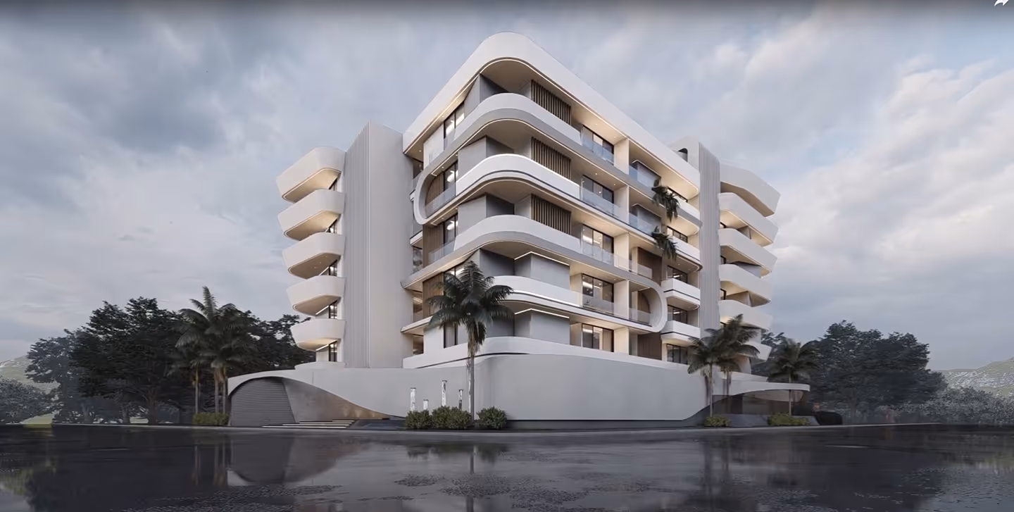 The Curve apartment block, its white balcony bands curving around the corner.