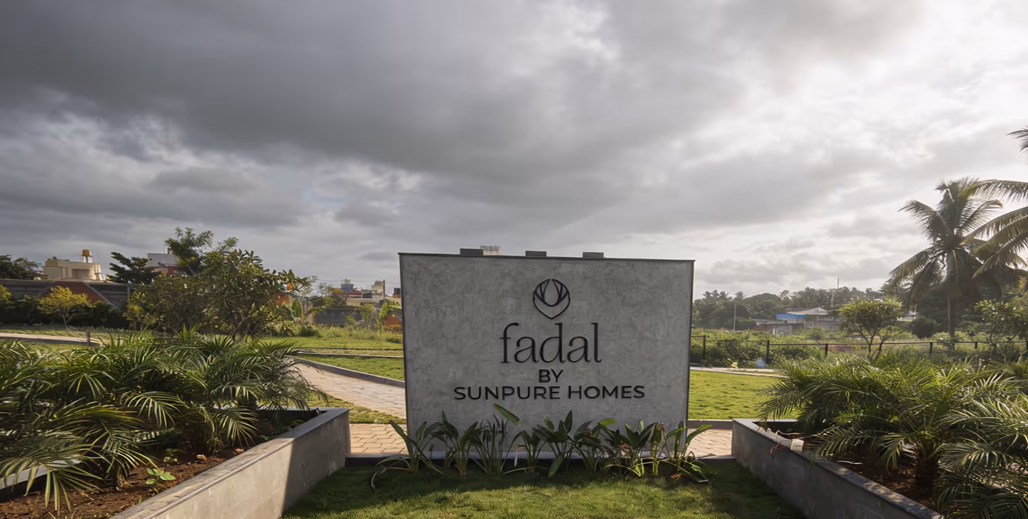 The Fadal entrance sign, cut into a low stone wall at the edge of the site.